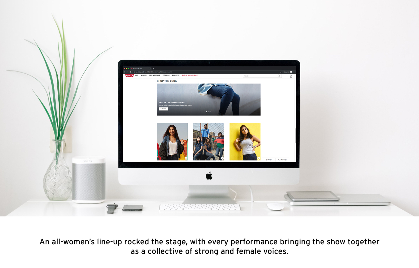 Apple iMac displaying a website featuring various images of women in different outfits